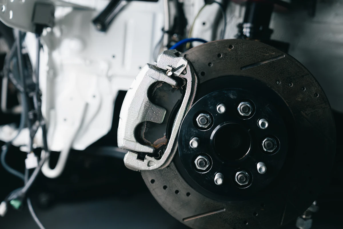 Brake disc and caliper on a car wheel hub